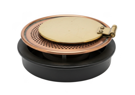 Vintage brass and copper ashtray with hinged lid isolated on transparent background