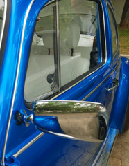 Blue metallic vintage car. vertical photo