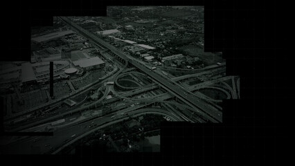 Fototapeta premium Aerial surveillance, military reconnaissance view of a complex highway interchange with HUD targeting graphics, creating a cinematic spy-drone atmosphere and intelligence-operation mood