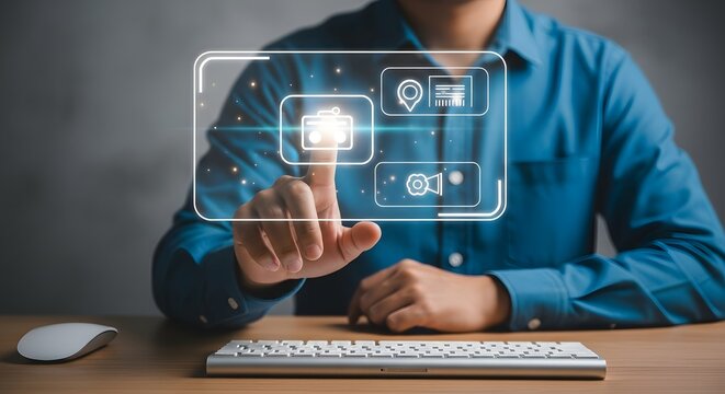 Man interacting with futuristic digital interface on a desktop computer