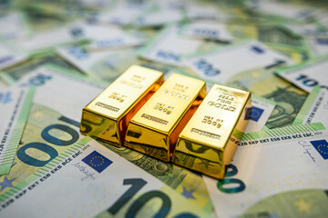 Gold bars with euro currency, financial analysis of investment strategy and market performance