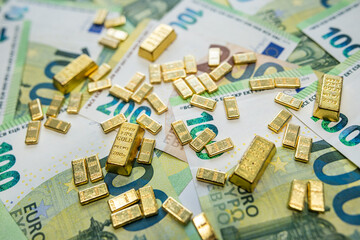 Gold and euro banknotes symbolizing financial market strength, trade value and economic growth