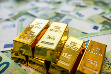 Gold and euro banknotes symbolizing financial market strength, trade value and economic growth