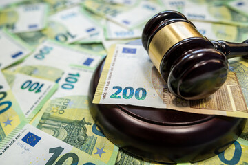 100 Euro banknotes and judge gavel concept of law and corruption control