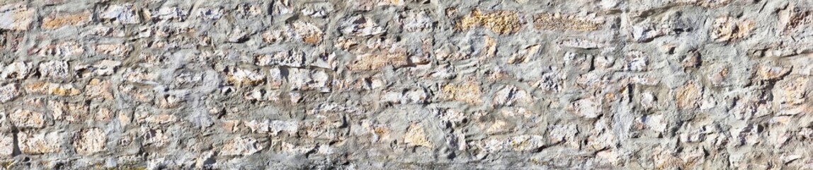 Fototapeta premium Beautiful rustic stone wall in poster size.