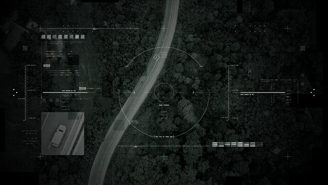 Aerial surveillance, military reconnaissance view of a complex highway interchange with HUD targeting graphics, creating a cinematic spy-drone atmosphere and intelligence-operation mood