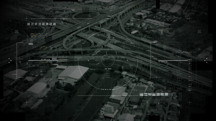 Aerial surveillance, military reconnaissance view of a complex highway interchange with HUD targeting graphics, creating a cinematic spy-drone atmosphere and intelligence-operation mood