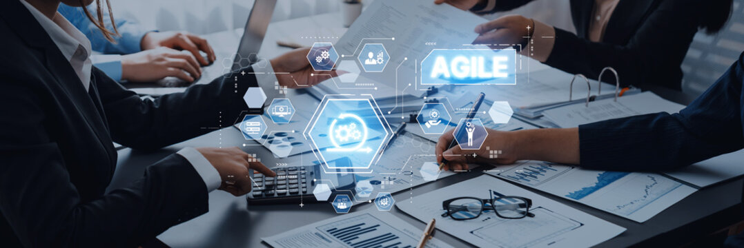 Team Collaboration and Agile Management in Modern Office, Business Professionals Working Together with Digital Tools on Table for Project Development Trope.