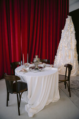 Christmas table setting, red background, vintage