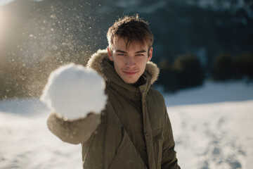 contemplative man with hand on his face and tense jaw stands against clean solid background