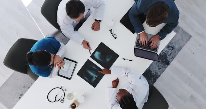 Medical, above or people in hospital with x ray, mri results or review for patient diagnosis. Healthcare, collaboration or radiologist in clinic with laptop, feedback or lung scan for treatment plan.