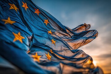 European Union flag backlit at dramatic sunset
