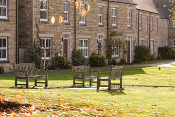 Seasonal outdoor scene with benches in autumn. Three benches conversation concept