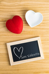 Blackboard, red heart, and white plate for Valentine's Day