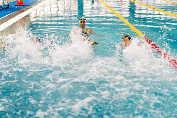 Children learning swimming techniques during a lesson