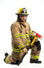 Fototapeta premium A firefighter in full turnout gear stands confidently with a rescue axe