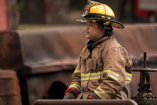 A feeling regret of a firefighter, sit and rests after performing an emergency response