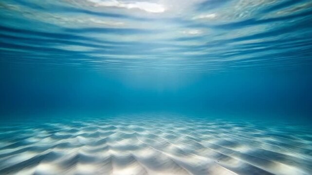 Serene Underwater Ocean Surface Ripples Sunlight Shimmering Through Clear Blue Water With Sandy