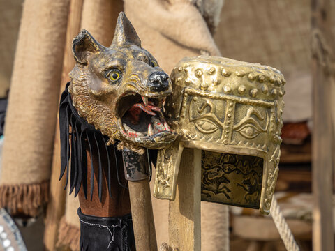 Celtic golden helmet and the Dacian flag with a wolf's head