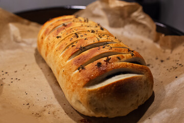Close-up of homemade vegan Wellington on parchment paper.