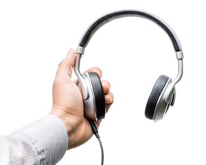 Hand holding silver and over ear headphones isolated on a transparent background