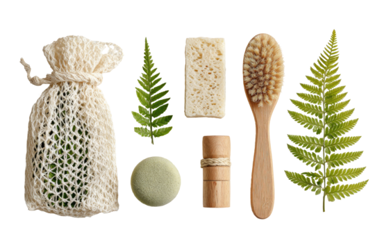 Eco-friendly toiletries arranged on a dark background, featuring a mesh bag, soap bar, brush, and leaves