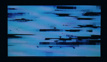 digital camera LCD screen showing heavy glitch artifacts, pixel noise, and distorted blue patterns...