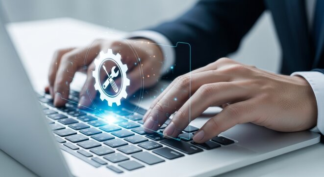 Digital it service and support: hands typing on laptop with gear icon overlay - Powered by Adobe