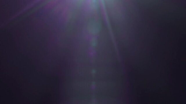 Cinematic Lens Flare Overlay on Black Background Slow Motion.