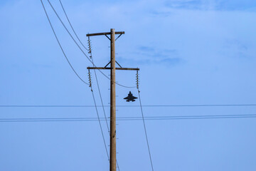 Photograph of a high-powered Jet aircraft flying at speed in regional Australia