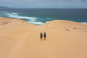 Couple Walking Through the Sand Dunes of Jandía, Fuerteventura