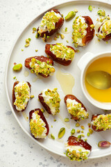 Honey Pistachio Ricotta stuffed Dates.selective focus