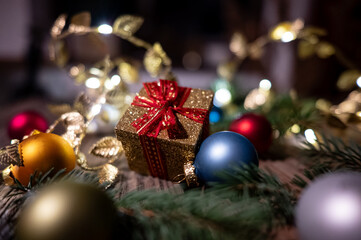 Golden Christmas Gift Box with Baubles and Festive Decorations