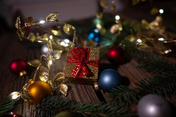 Golden Christmas Gift Box with Baubles and Festive Decorations