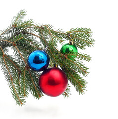 Christmas tree branch with ornaments.