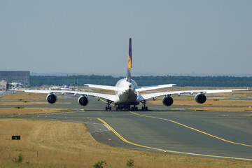 Frankfurt, Germany, July 9, 2017: Airbus A380 on Taxiway Seen from Behind