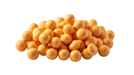A pile of small, round, orange candies is scattered against a white background.