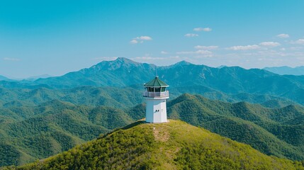 Drone view of mountain forest with active fire watchtower equipped with detection sensors. 