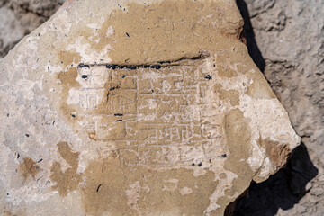Cuneiform tablets and pottery fragments discovered at an archaeological site in Uruk Iraq, revealing ancient writing techniques