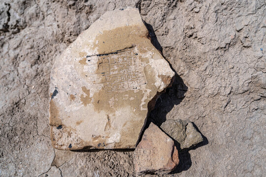 Close-up view of Cuneiform writing at the ruins of Uruk, a major ancient city in Mesopotamia, Iraq