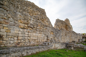 Fortress wall made of stone from the ancient city on a clear sunny day, Chersonesos. Sights of Russia. Architecture of World tourism.