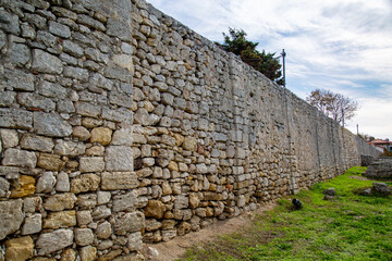 Stone fortress wall on a clear sunny day, Chersonesos. Sights of Russia. Architecture of World tourism. © Victor1153