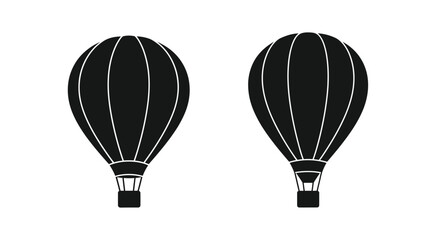 Obraz premium Two black silhouette hot air balloons against a plain white background
