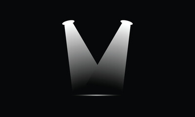 Pair of spotlights casting bright light onto a dark stage floor