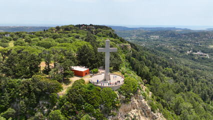 Aerial drone photo of iconic Monastery and giant Cross of Filerimos, built uphill in ruins of...