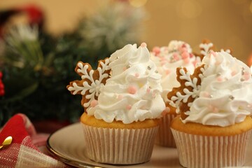Festive cupcakes with cookies on table, closeup. Christmas treat