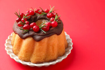Tasty Christmas cake with cranberries on red background, closeup. Space for text