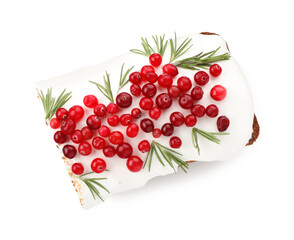 Tasty Christmas cake with icing, cranberries and rosemary isolated on white, top view