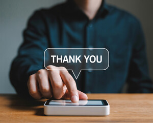 Modern businessman expressing gratitude with a digital thank you on his mobile device, showing appreciation and positive feedback in a professional setting
