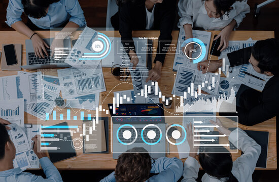 Engaging corporate meeting focused on data analysis with teams collaborating over charts, graphs, and reports in a modern office setting. Ideal for business themes. Trope